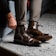 Close-up of a person trying on comfortable shoes indoors.