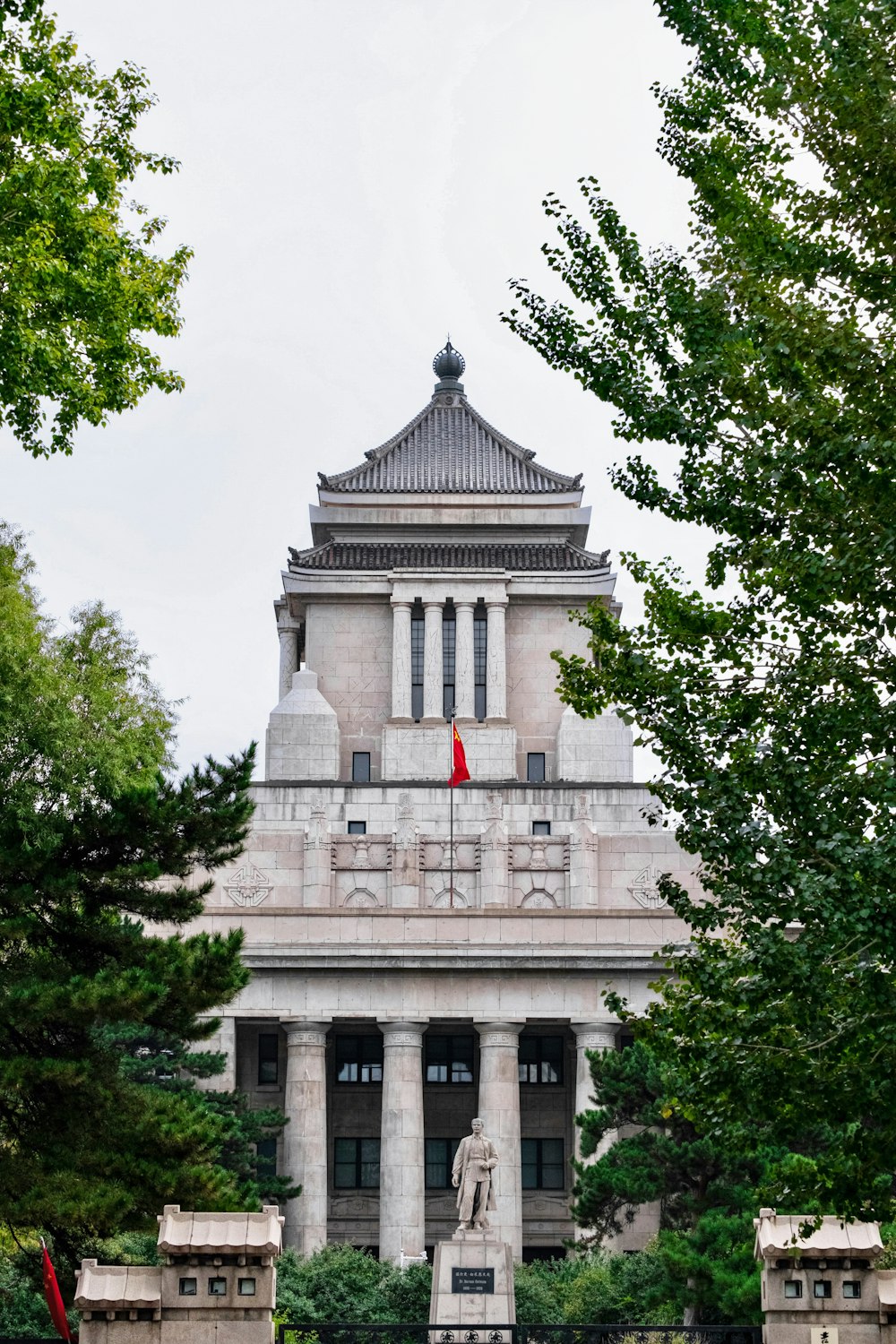 a large building with a statue in front of it