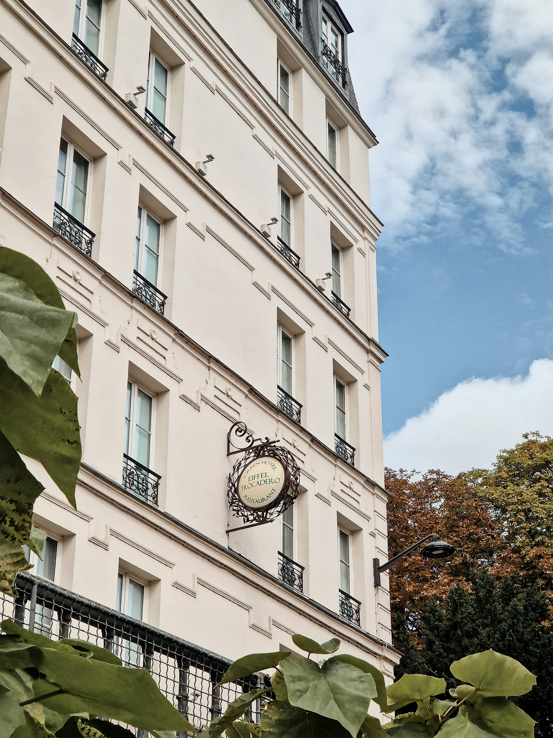 woman wearing yellow long-sleeved dress under white clouds and blue sky during daytime