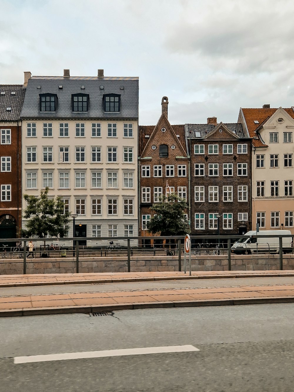 a row of buildings on the side of a road