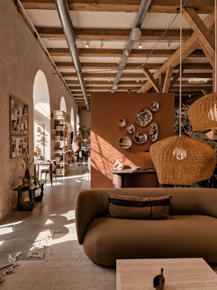 Cozy living room with warm terracotta and chocolate tones, reflecting a welcoming home atmosphere.