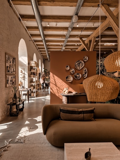 A cozy living room setup featuring earthy-toned cushions and wooden furniture.