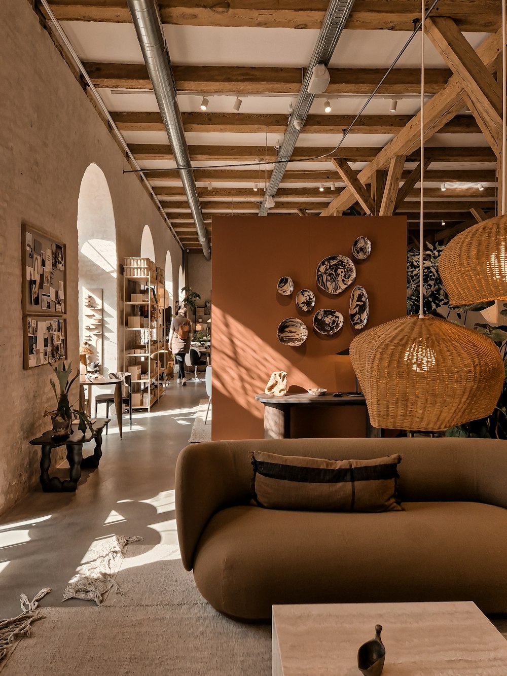 a living room filled with lots of furniture and decor