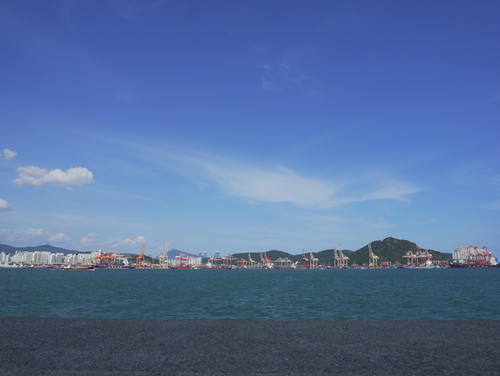 a body of water with a city in the background