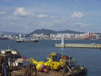 A vibrant seaport bustling with eco-friendly cargo operations under clear skies.