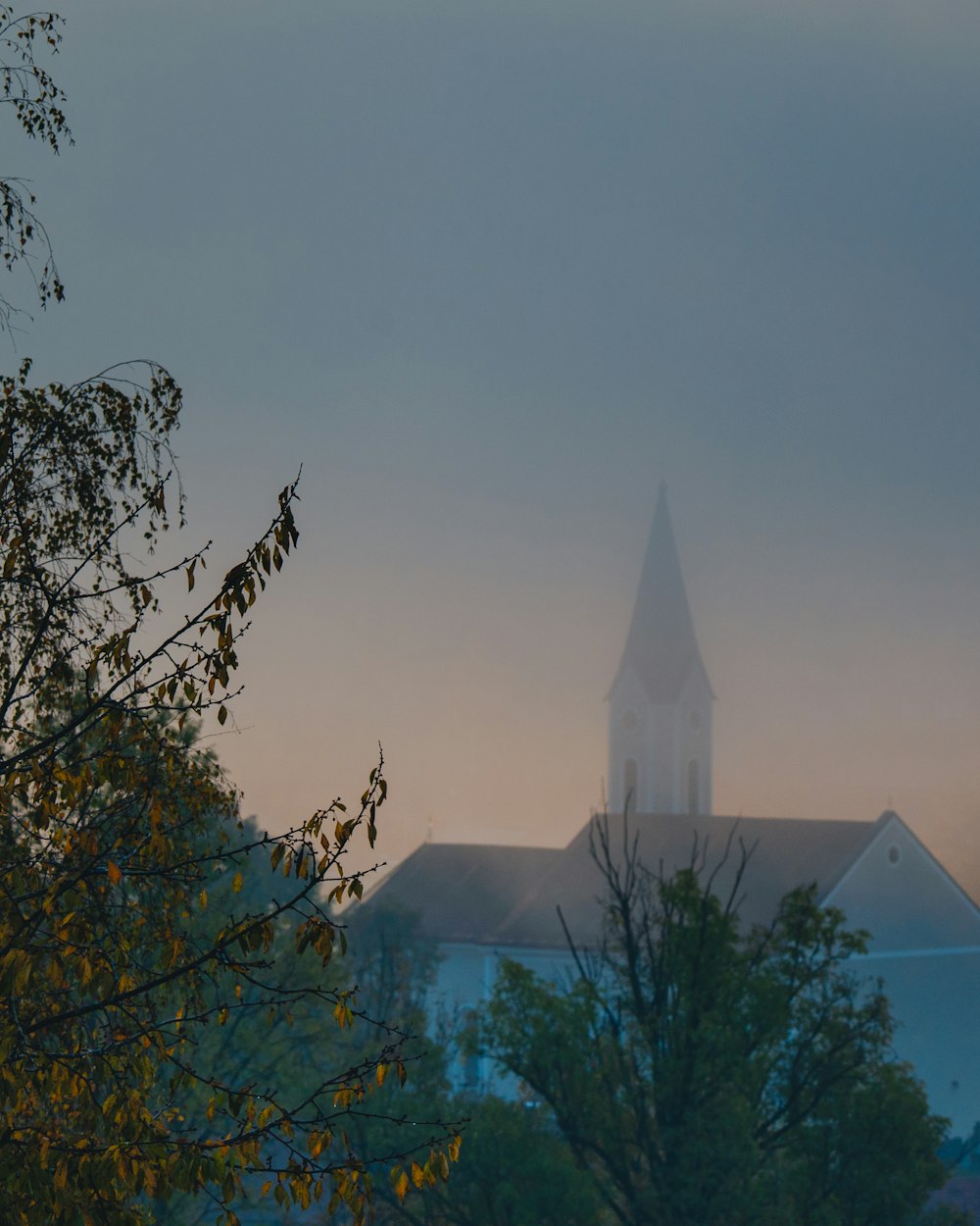 a church with a steeple in the background