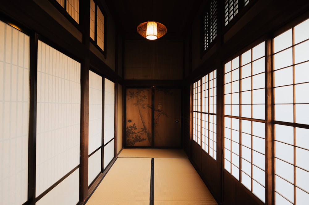 a hallway with a light hanging from the ceiling