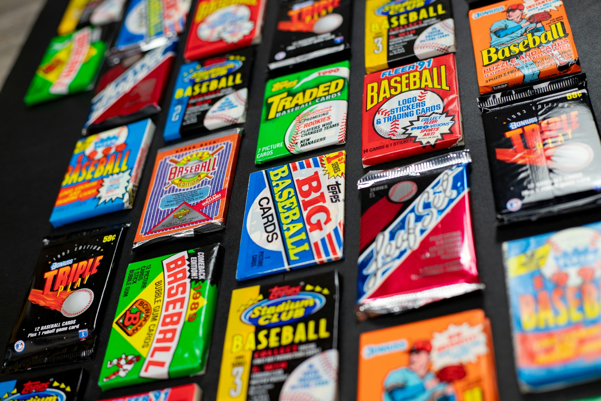 A neatly arranged display of Johnny Apple Springs packs in 10, 25, 50, and 100 counts, with a vintage Spinjas box and a nostalgic 1980s vibe.