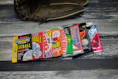 Close-up of vintage baseball cards spread out on a wooden table