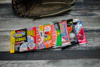 Close-up of vintage baseball cards spread out on a wooden table