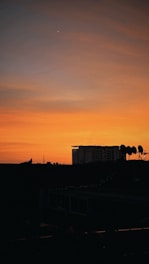 A city skyline at dusk with glowing wireless signals connecting buildings.