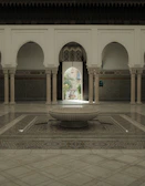 Traditional riad courtyard with lush greenery and intricate tilework.