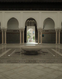 A charming riad with traditional Moroccan tiles and a lush inner courtyard garden.