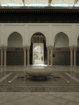 Elegant riad courtyard bathed in warm natural light with golden accents