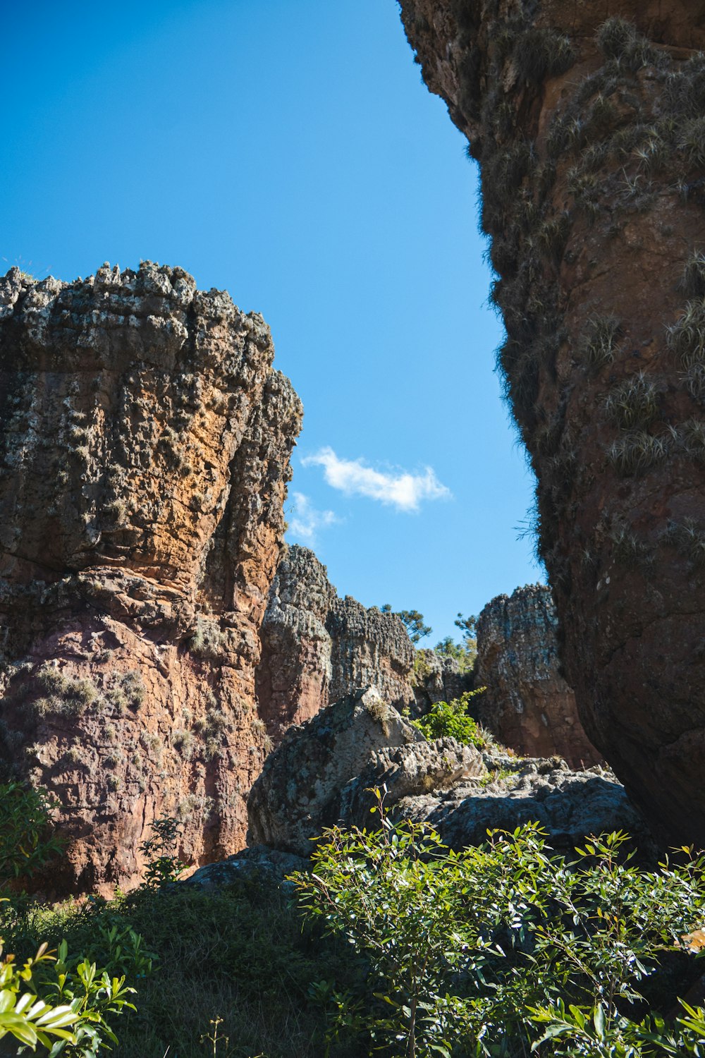 a view of a rocky outcropping with a blue sky in the background