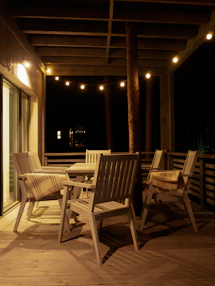 Cozy Fort Myers patio with new decking and custom outdoor lighting at dusk.