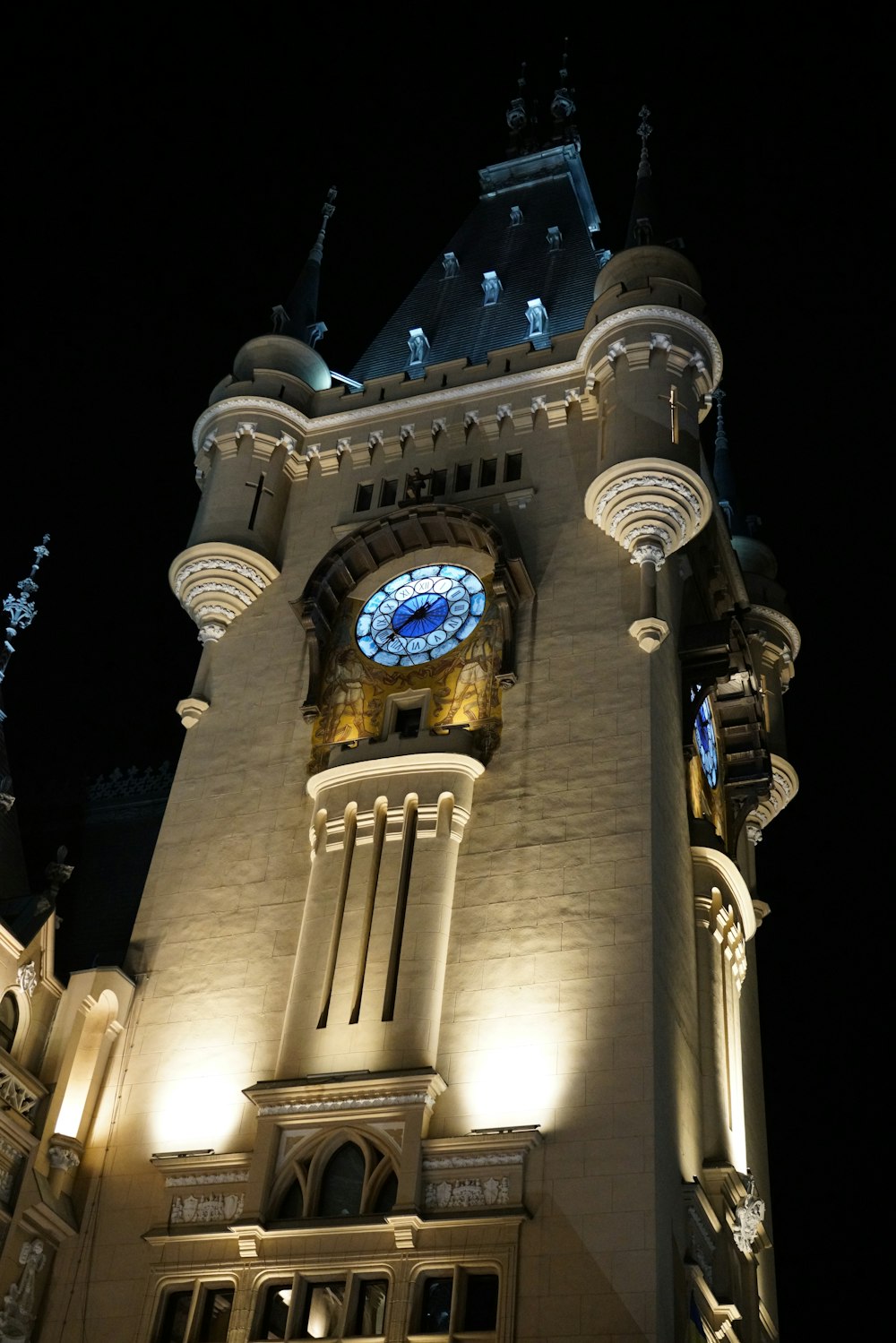 a large clock tower lit up at night