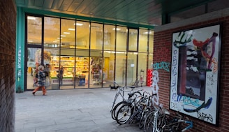 A bright and inviting storefront of Komal Cycle Stores with a variety of bicycles displayed outside.
