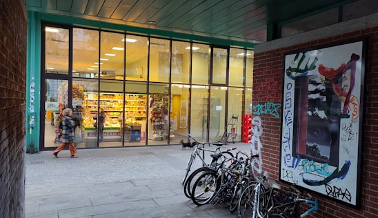 A bright and inviting storefront of Komal Cycle Stores with a variety of bicycles displayed outside.