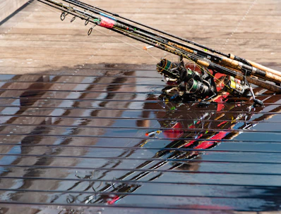 Finished fishing rod resting on a wooden table, highlighting craftsmanship.