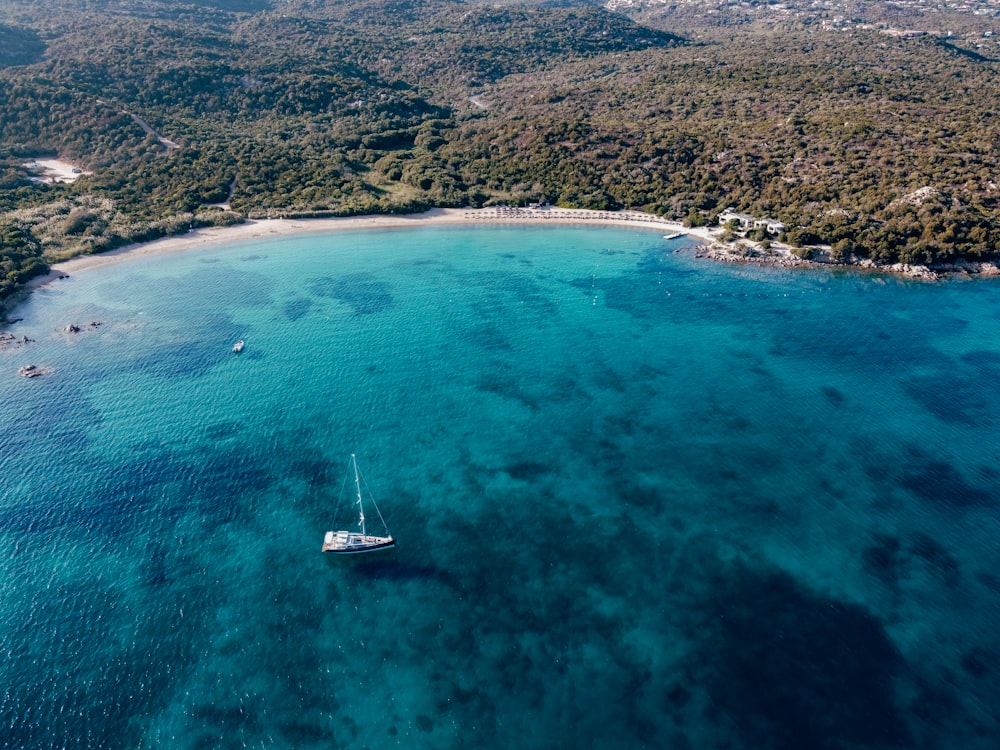 an aerial view of a boat in the water