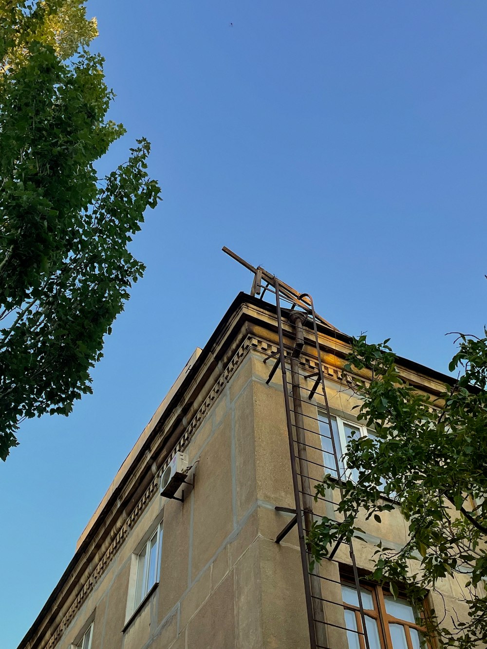 a tall building with a ladder on top of it