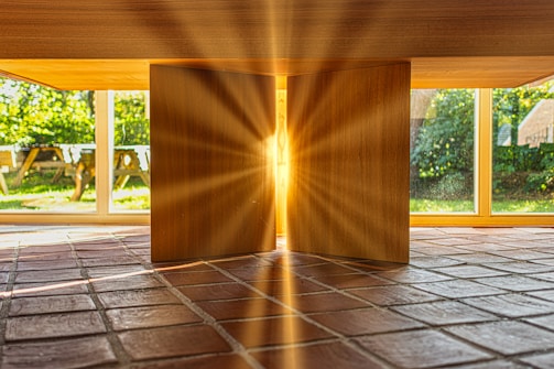 Sunlight streaming through spotless glass doors in a cozy home.