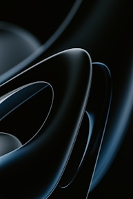 Abstract futuristic shapes with metallic gold and deep black tones.