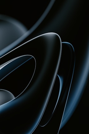 Smooth, glossy, abstract shapes in a dark color palette with overlapping curves and a futuristic appeal.