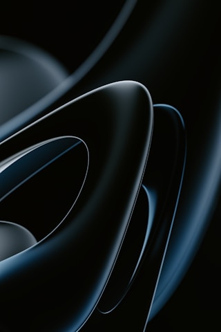 Abstract futuristic shapes with metallic gold and deep black tones.
