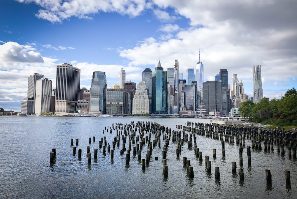 a large body of water with a city in the background