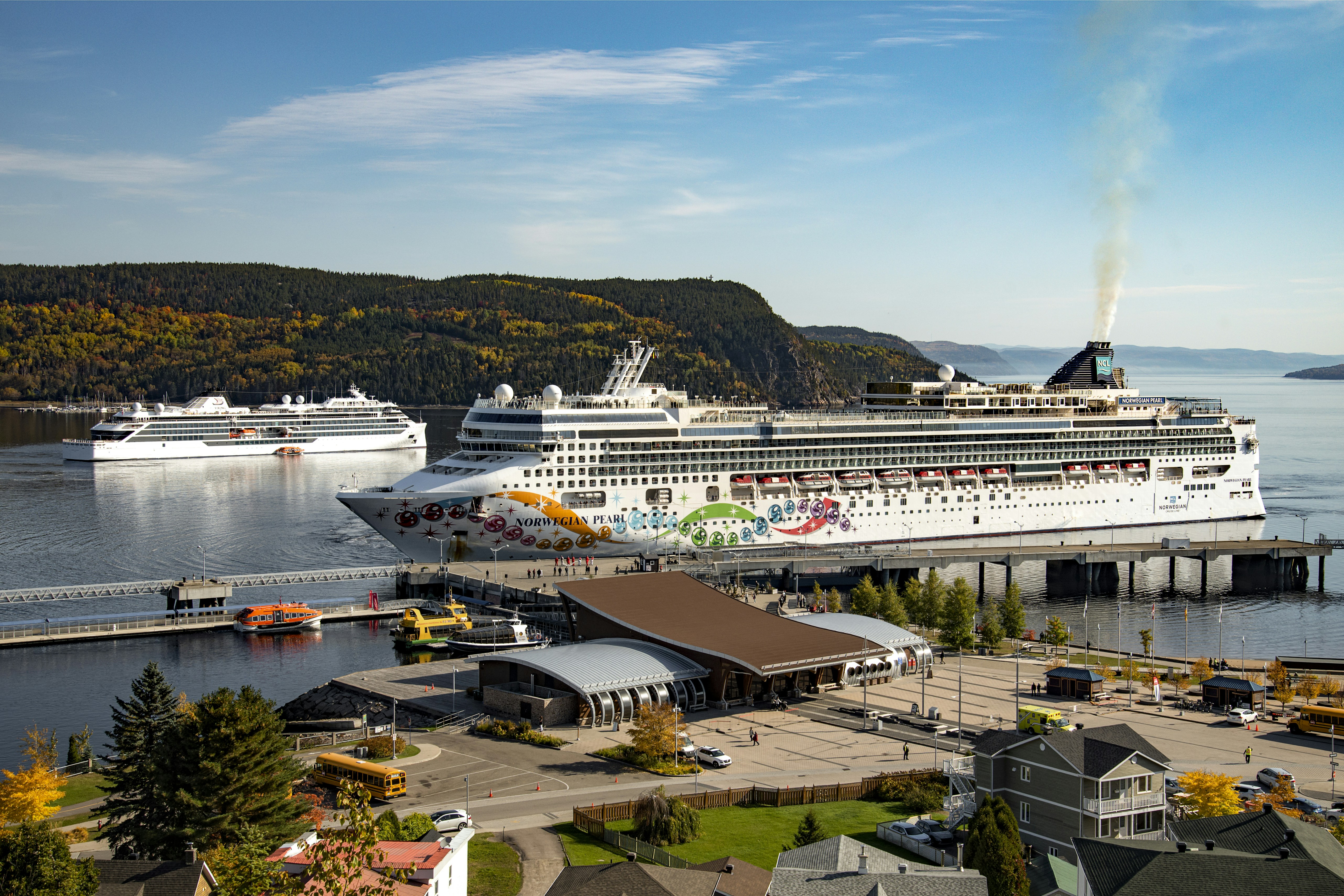 a cruise ship is docked at a dock