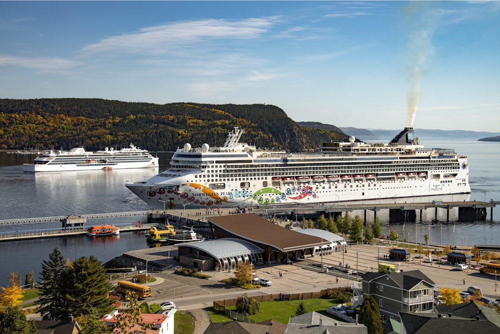 a cruise ship is docked at a dock