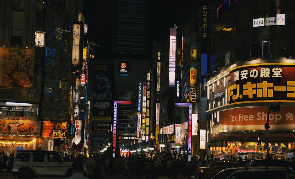 a city street filled with lots of tall buildings