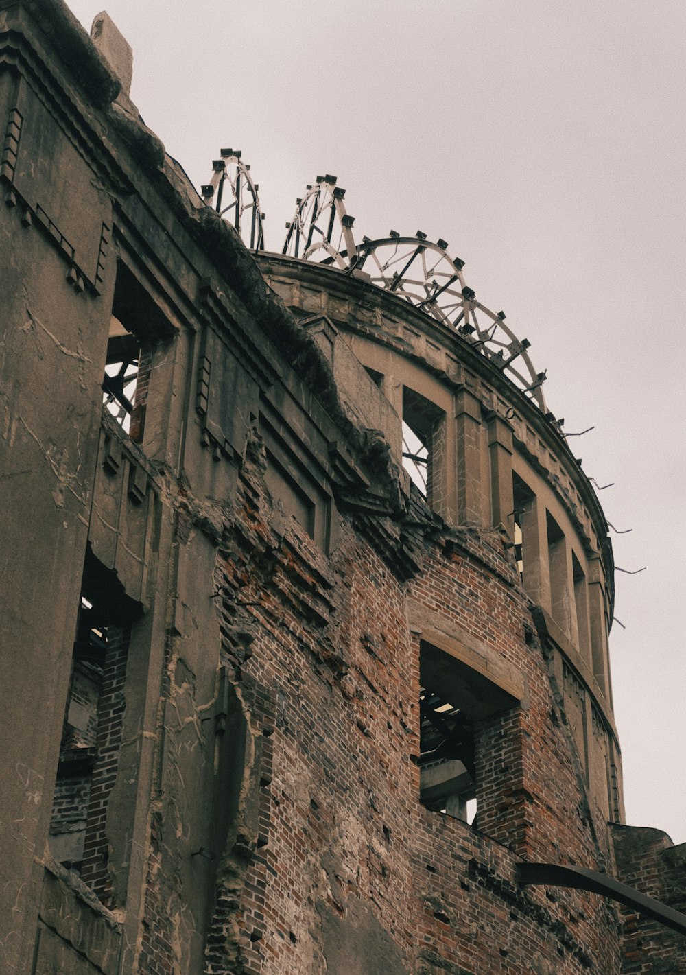 a very old building with a bunch of bikes on top of it