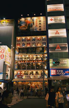 A vibrant night scene of Tokyo with glowing lanterns and bustling streets.