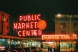 a public market center lit up at night