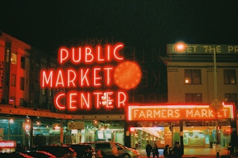 a public market center lit up at night