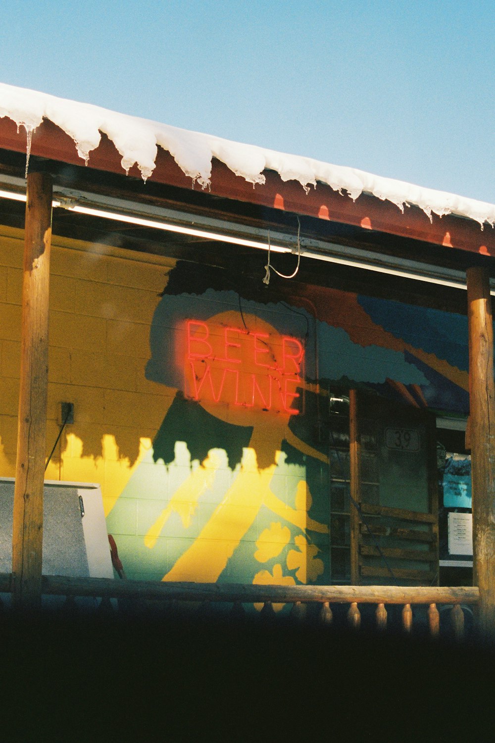 a building with a sign that says beer wine