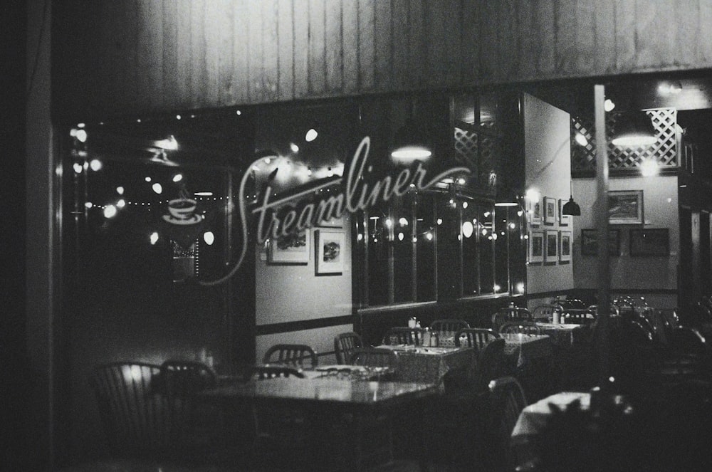 a black and white photo of a restaurant