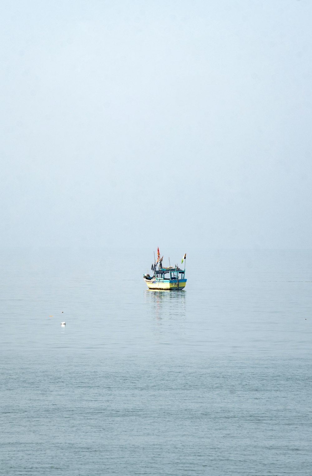 a boat floating on top of a large body of water