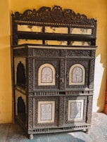 An intricate reclaimed teak cabinet showcasing fine detailing and craftsmanship.