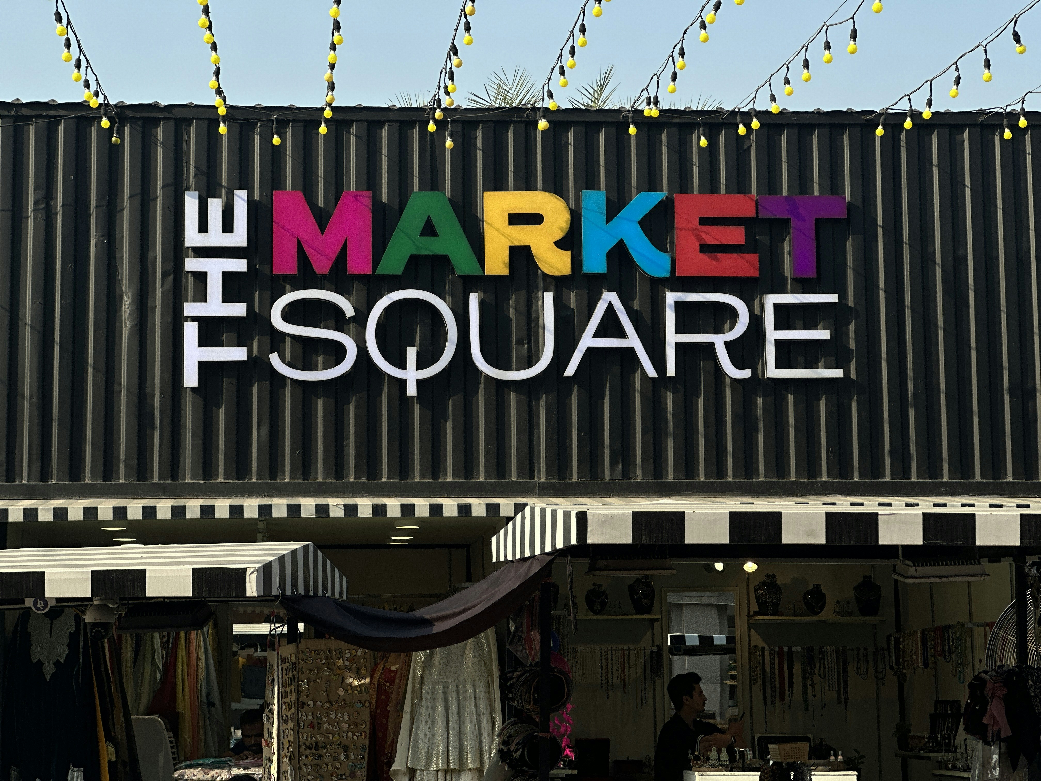 a market with a sign that says the market square