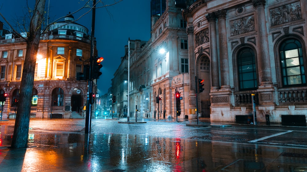 a city street at night with a traffic light