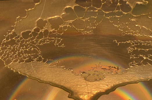 Close-up of golden candied honey crystals glistening under soft light