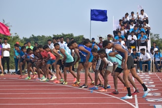 A group of athletes wearing matching custom tracksuits, ready for their event.