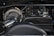 A close-up view of a car engine showcasing a turbocharger with 'BorgWarner' branding. The engine components display a mix of metallic and carbon fiber textures.