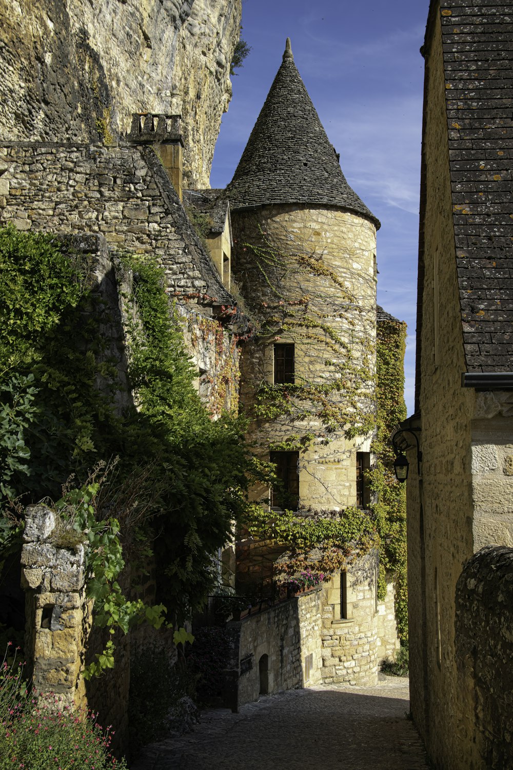 a stone building with a tower on top of it