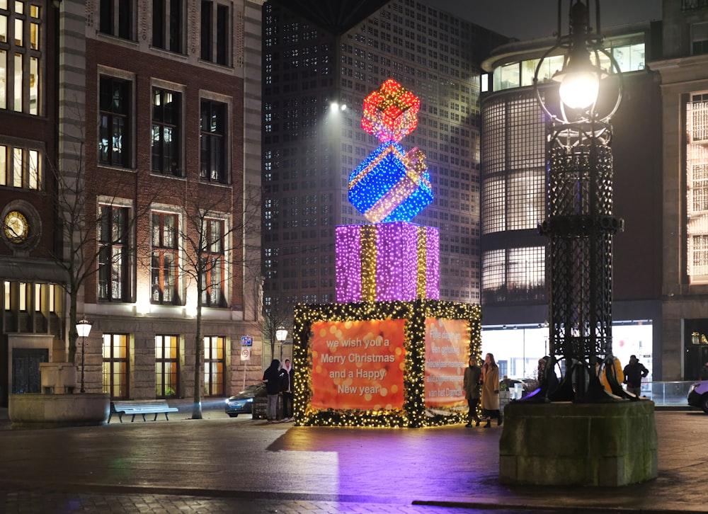 a colorful display in the middle of a city at night