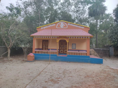 The serene temple at Om Aashram adorned with traditional Indian decorations during a festival.